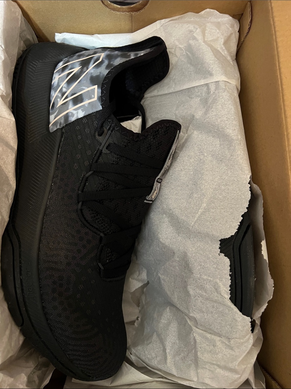 New Balance Black Athletic Shoes with Silver Accent